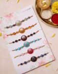Crystal With Lotus Round Charm Rakhi Set